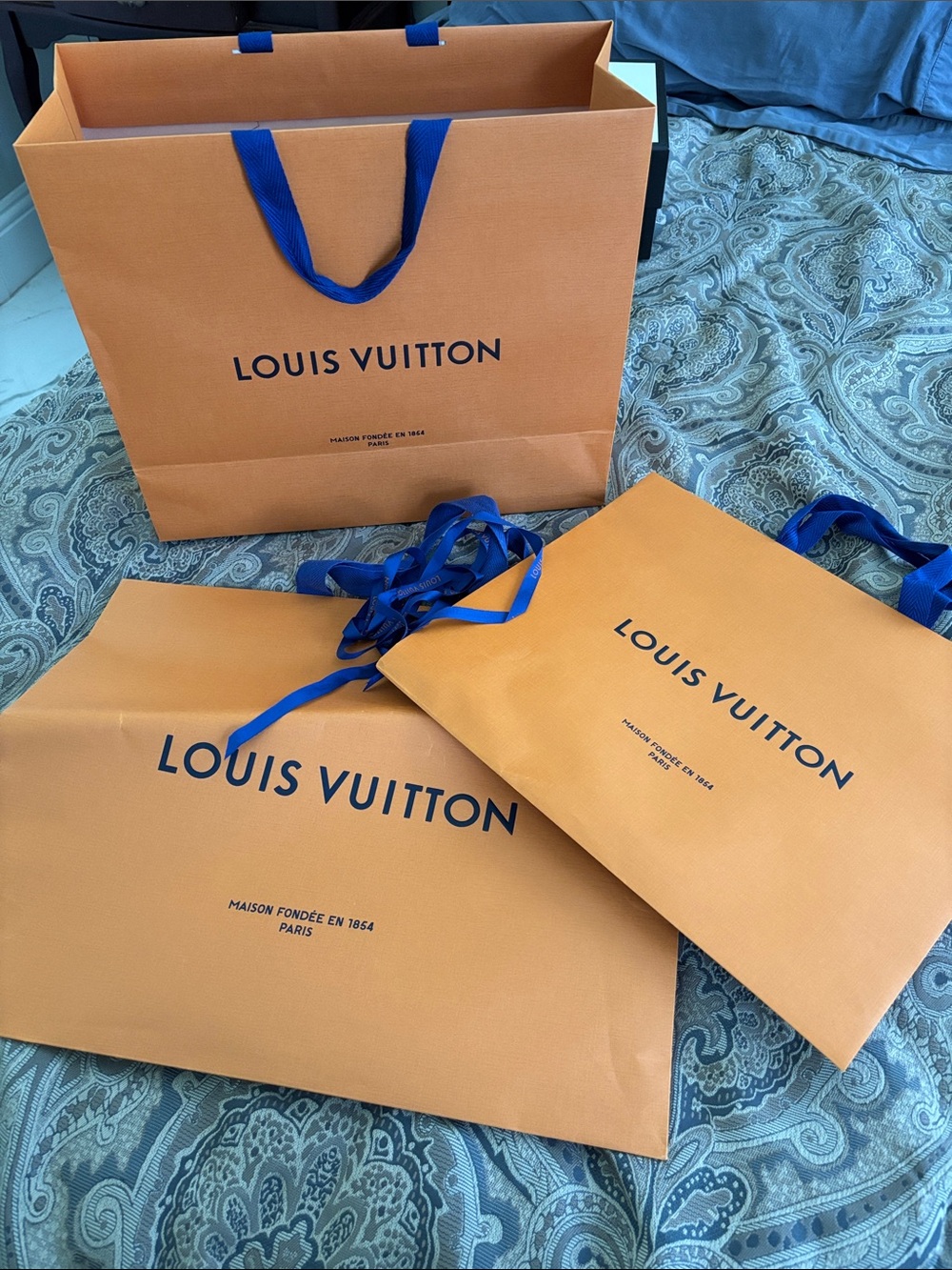 Louis Vuitton Orange Shopping Bags with Blue Handles and Navy Logo